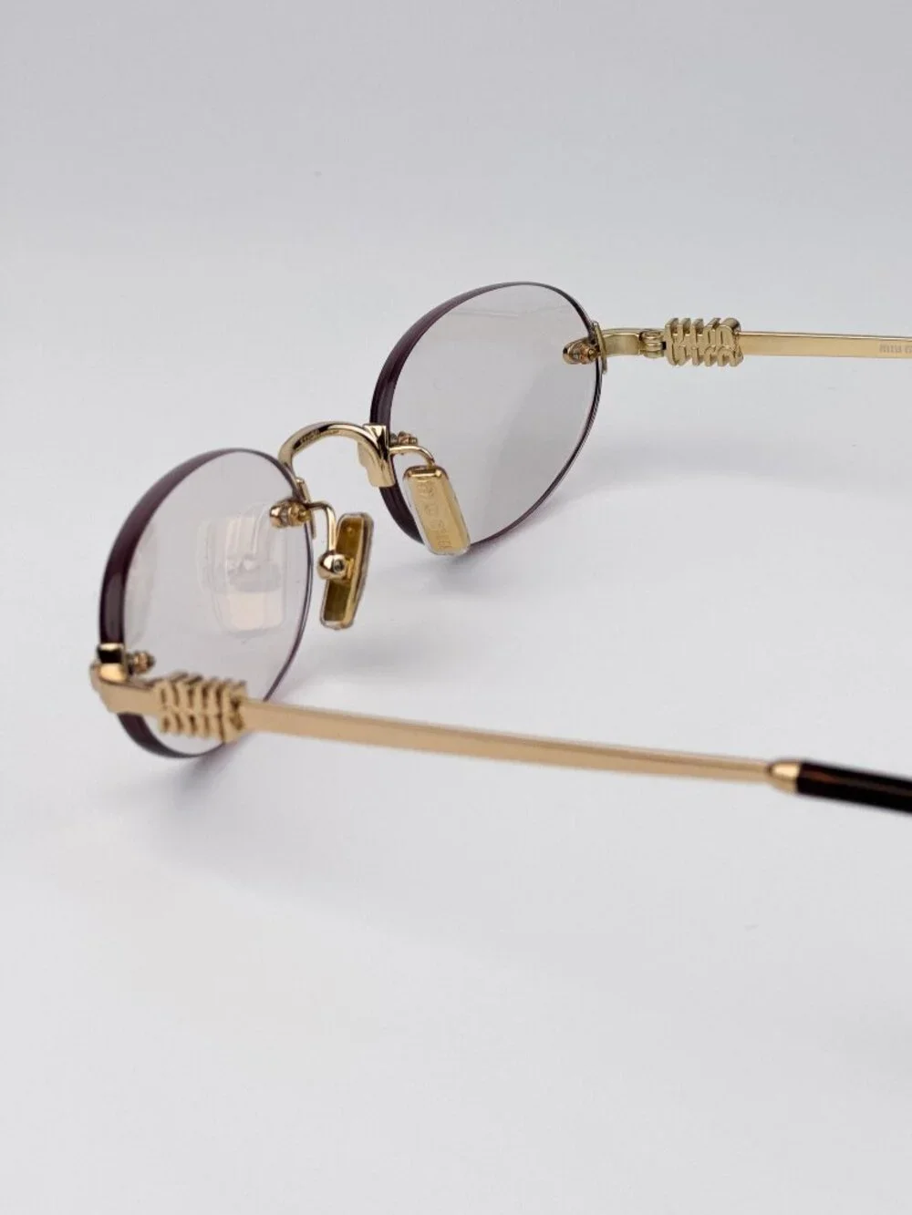 Miu Miu Women’s Eyeglasses – MUA54S 5AK08N | Gold Oval Rimless